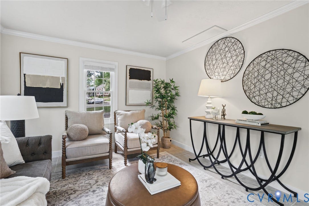 This light and bright sun room is right off of the kitchen and provides access to the outdoor patio.