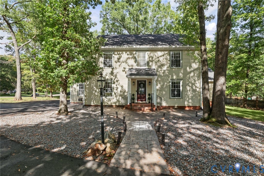 An oversized paved driveway adds everyday convenience to this beautifully situated property. Beautifully refreshed inside and out, this traditional colonial offers enduring character with modern updates.