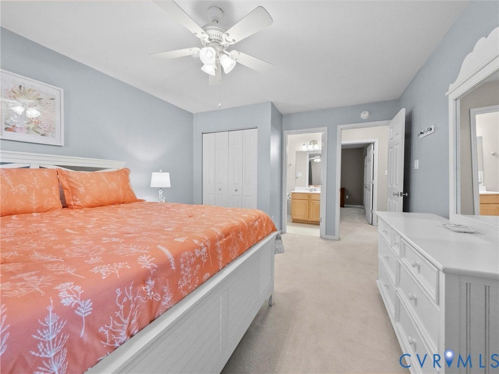 Recessed lighting, ceiling fan, bi-fold closet doors, and light-colored carpeting