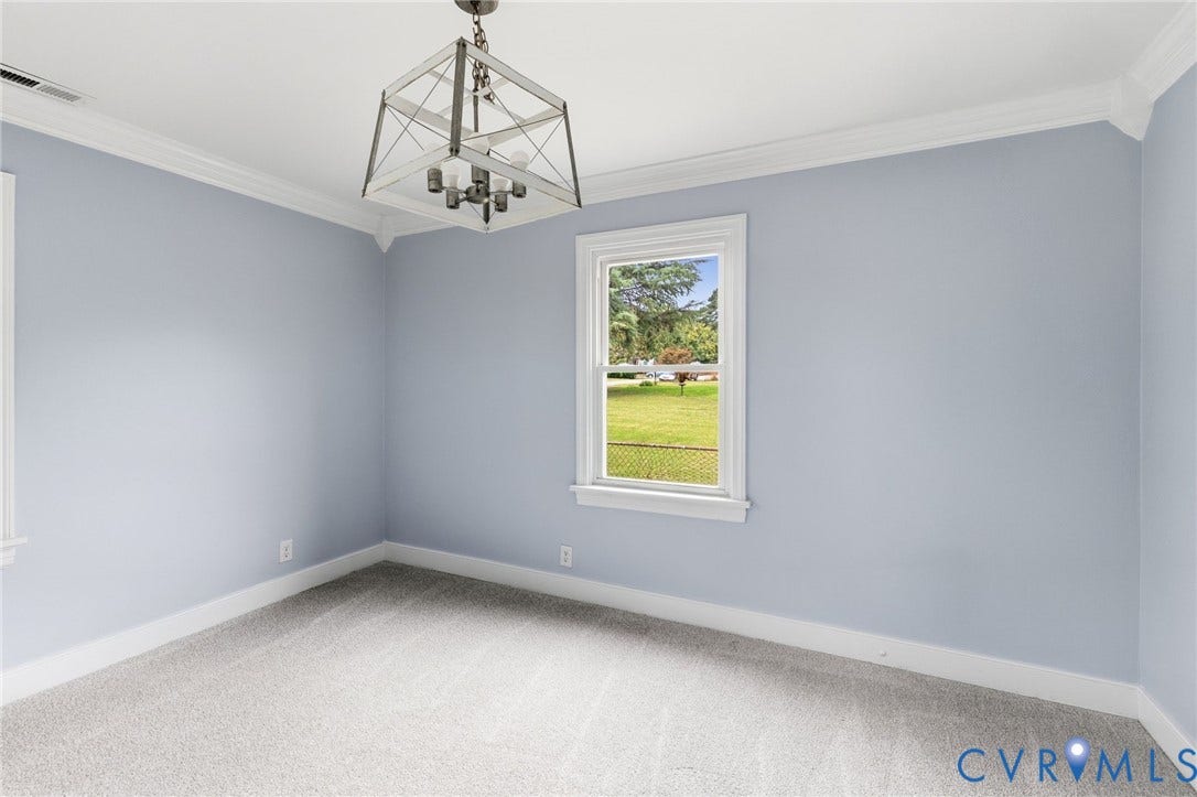 5901 Bonneau Road, Richmond, VA 23227 Fitted carpet, crown molding, white trim, and a chandelier with a metal and wood-finish frame