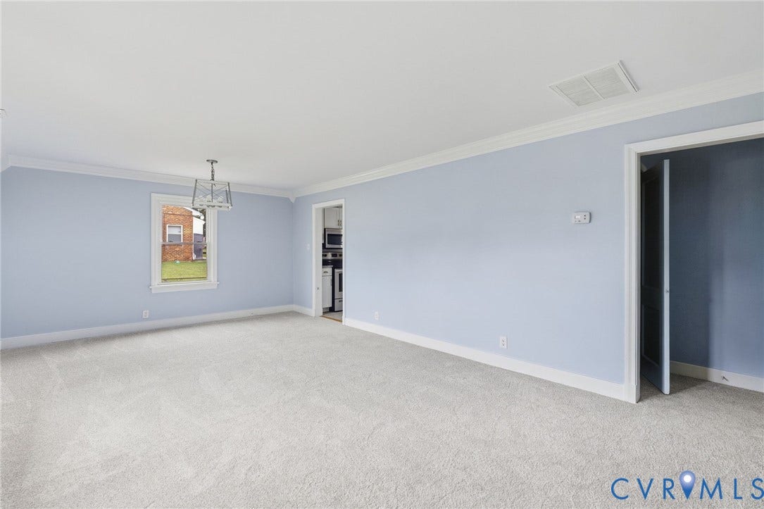 5901 Bonneau Road, Richmond, VA 23227 Light gray wall-to-wall carpeting, light blue wall paint, white crown molding, and a modern ceiling fixture