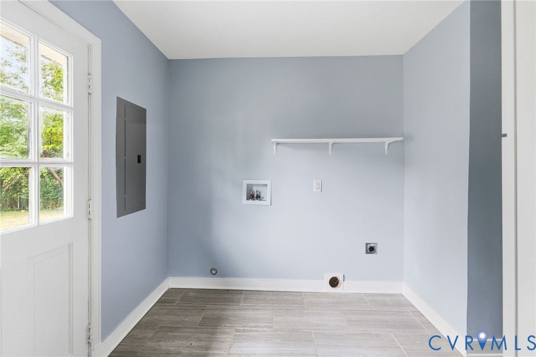 5901 Bonneau Road, Richmond, VA 23227 Light blue wall finish with white trim, wood-finish flooring, and a white built-in shelf