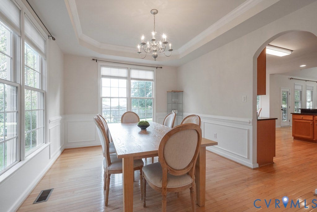Formal dining with lots of natural light, tray ceiling