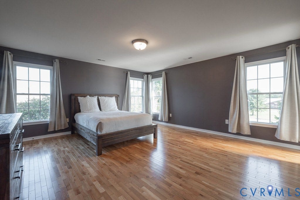 Lots of natural light, Primary bedroom hardwood floors
