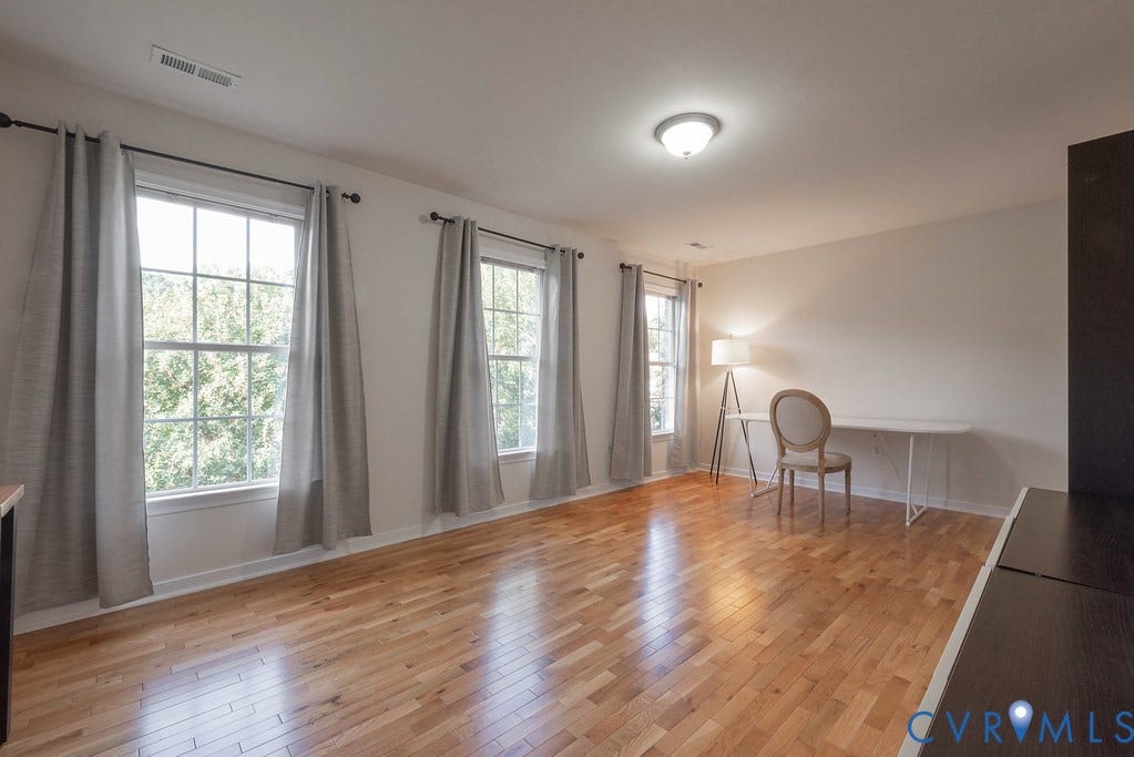 Extra Large Bedroom Two, hardwood floors, nice size closet, used as office.