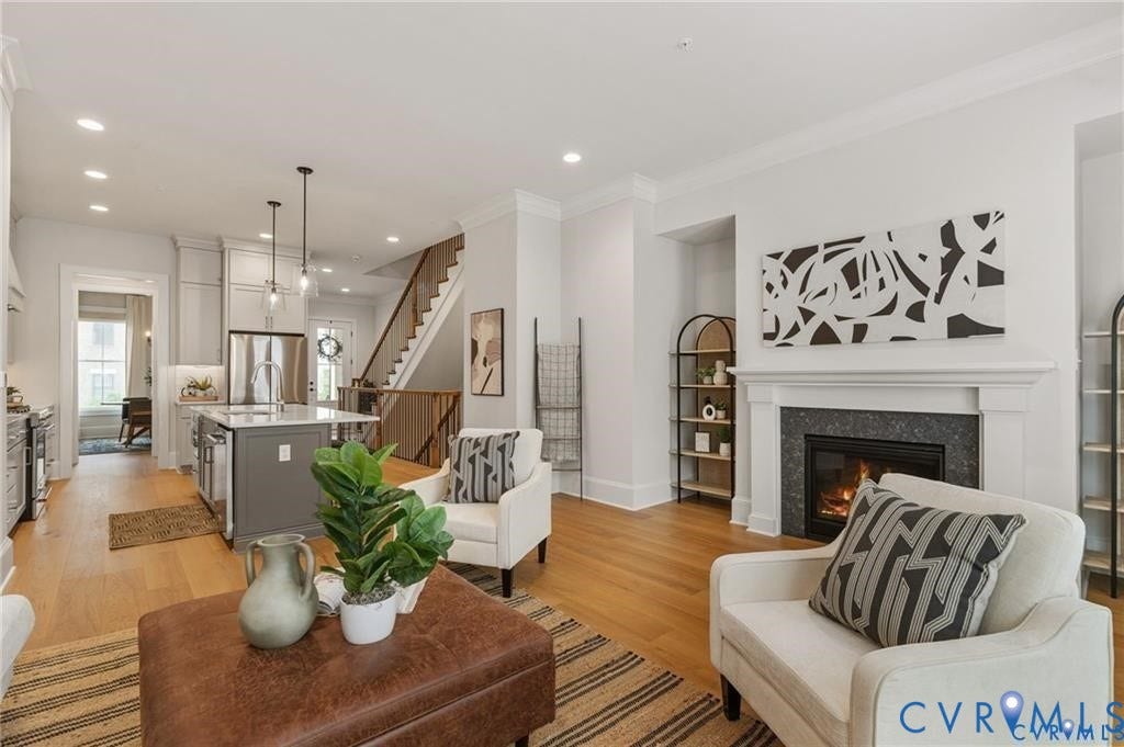 Fireplace, hardwood floors and rear deck access make the living room especially inviting.