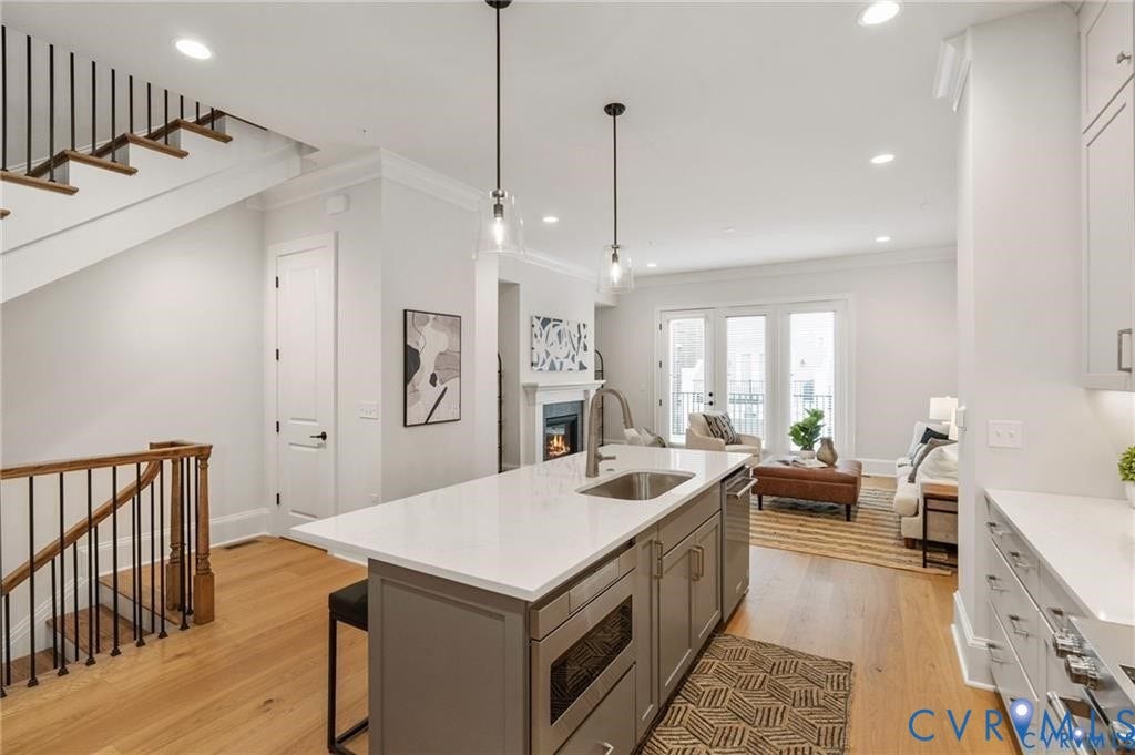 Open sightlines connect the kitchen and living room for easy everyday living and entertaining.