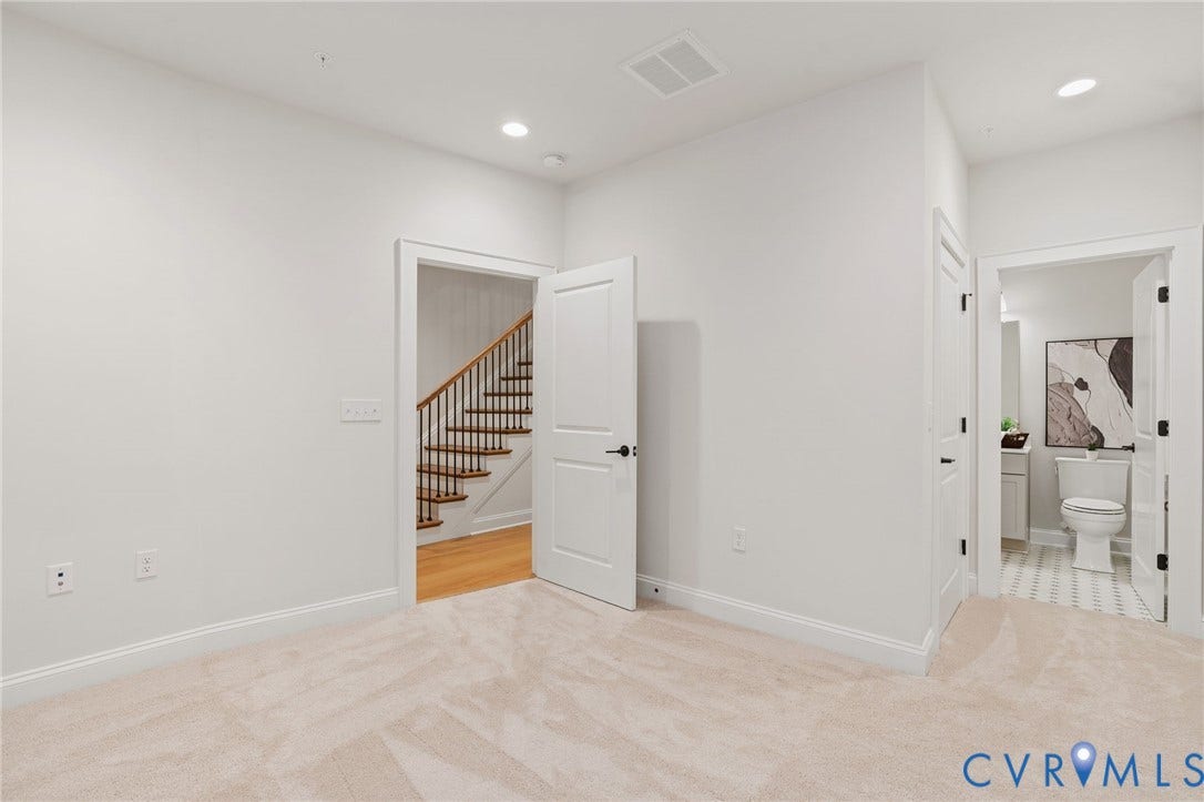 Spacious bedroom on lower level with en suite. Perfect for a home office or guest or teenage suite!
