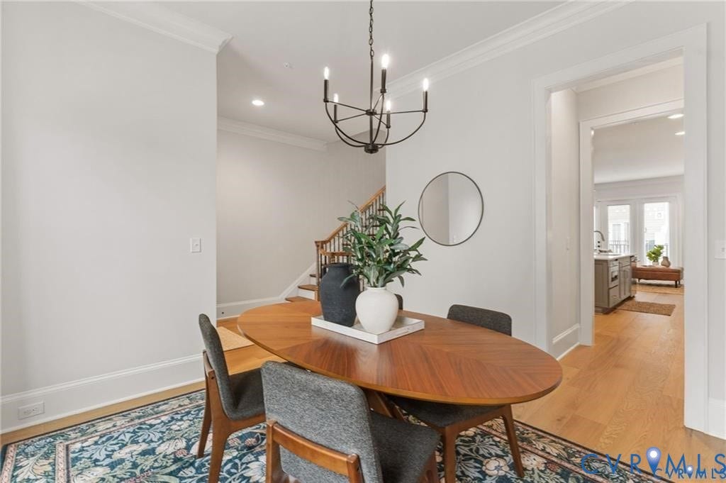 Chandelier lighting and direct kitchen access make this dining room ideal for entertaining.