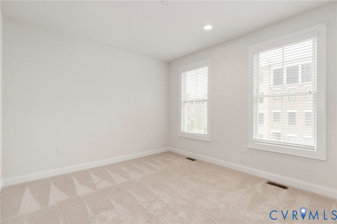 Bedroom #3 located on level 3 down the hall from the primary bedroom. Perfect for a nursery and childs bedroom!