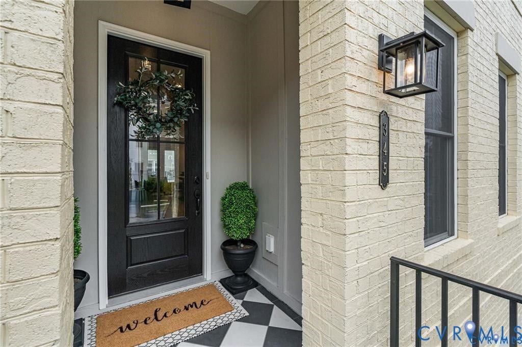 Covered front entry with classic detailing and a welcoming front door.
