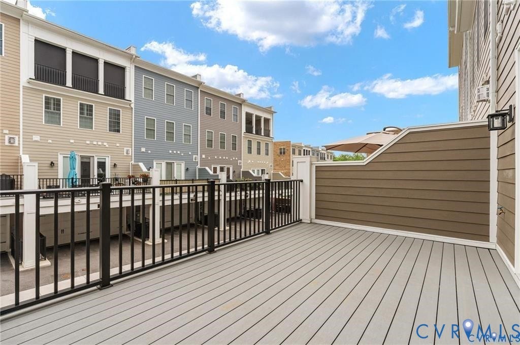 Spacious rear deck directly off the main living area extends entertaining outdoors.