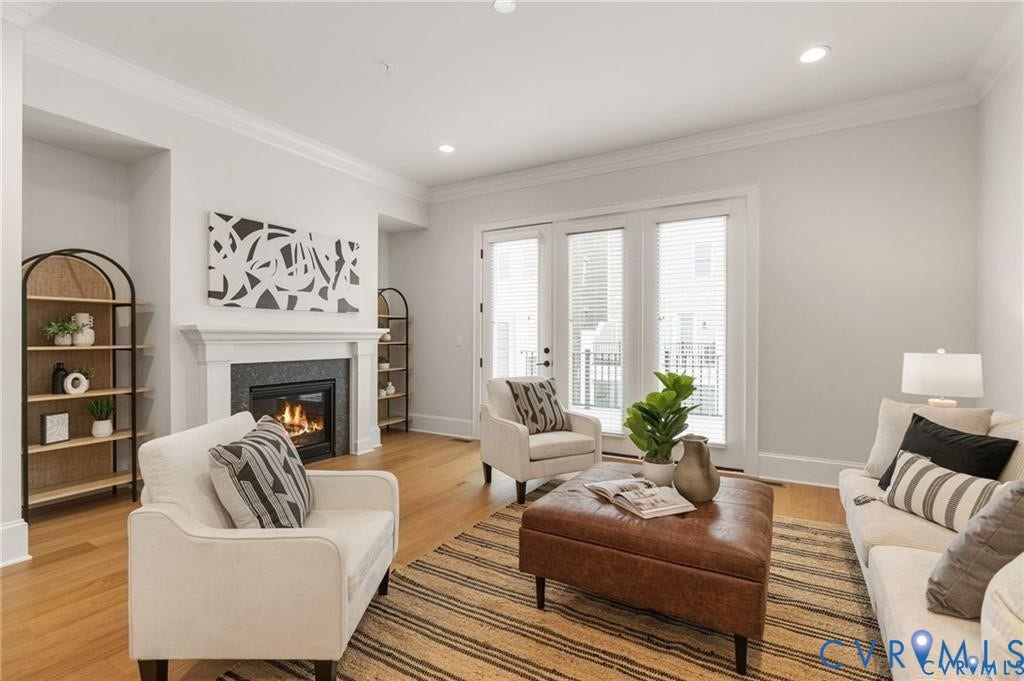 Fireplace, hardwood floors and rear deck access make the living room especially inviting.
