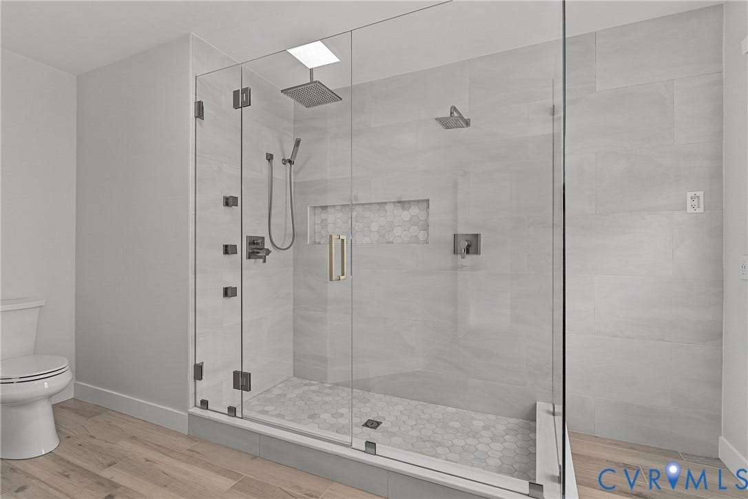 11100 Glen Hollow Court, Henrico, VA 23233 Walk-in shower with clear glass enclosure and multiple shower heads