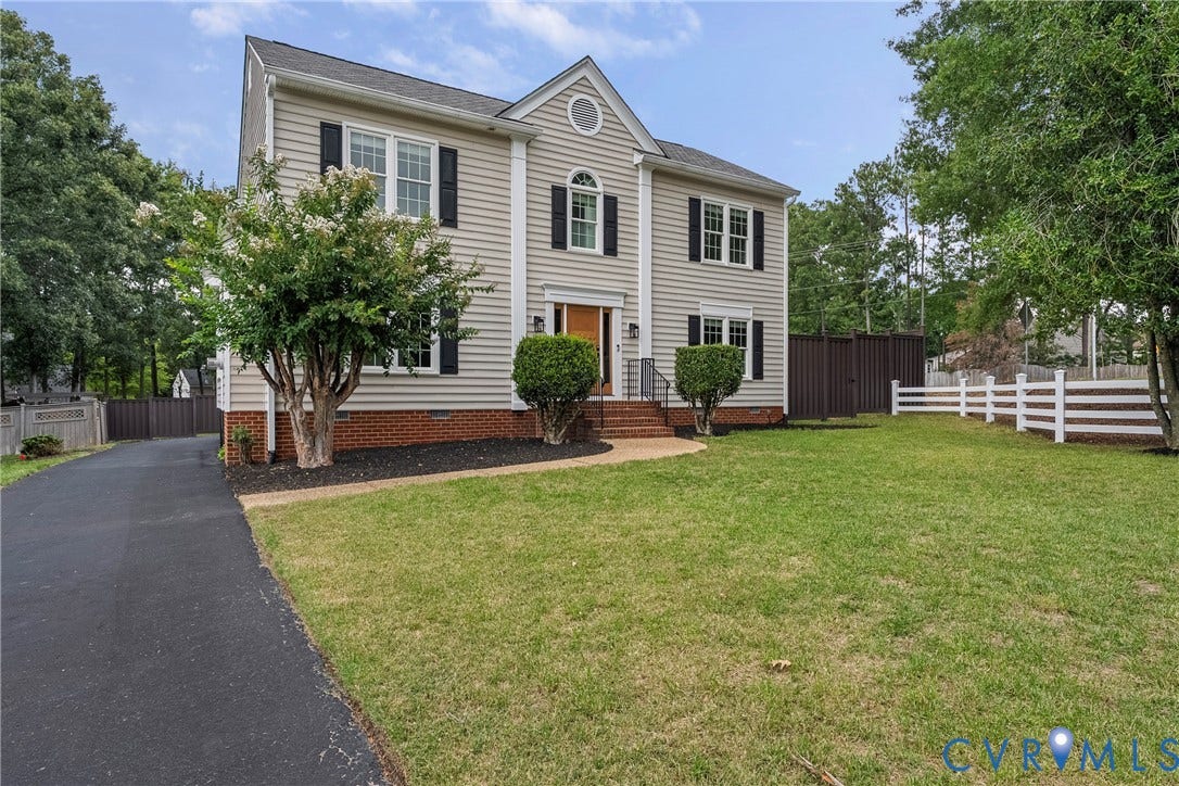 11100 Glen Hollow Court, Henrico, VA 23233 Two-story home featuring light-colored siding, black shutters, and a prominent front entrance