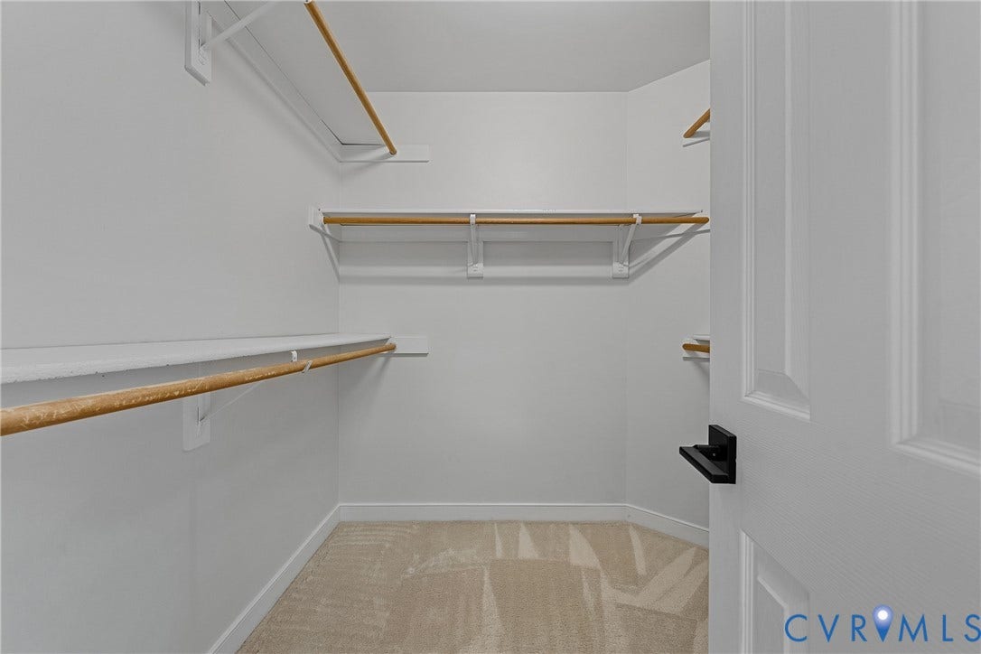 11100 Glen Hollow Court, Henrico, VA 23233 Walk-in closet with multiple shelving units, hanging rods, and carpet flooring