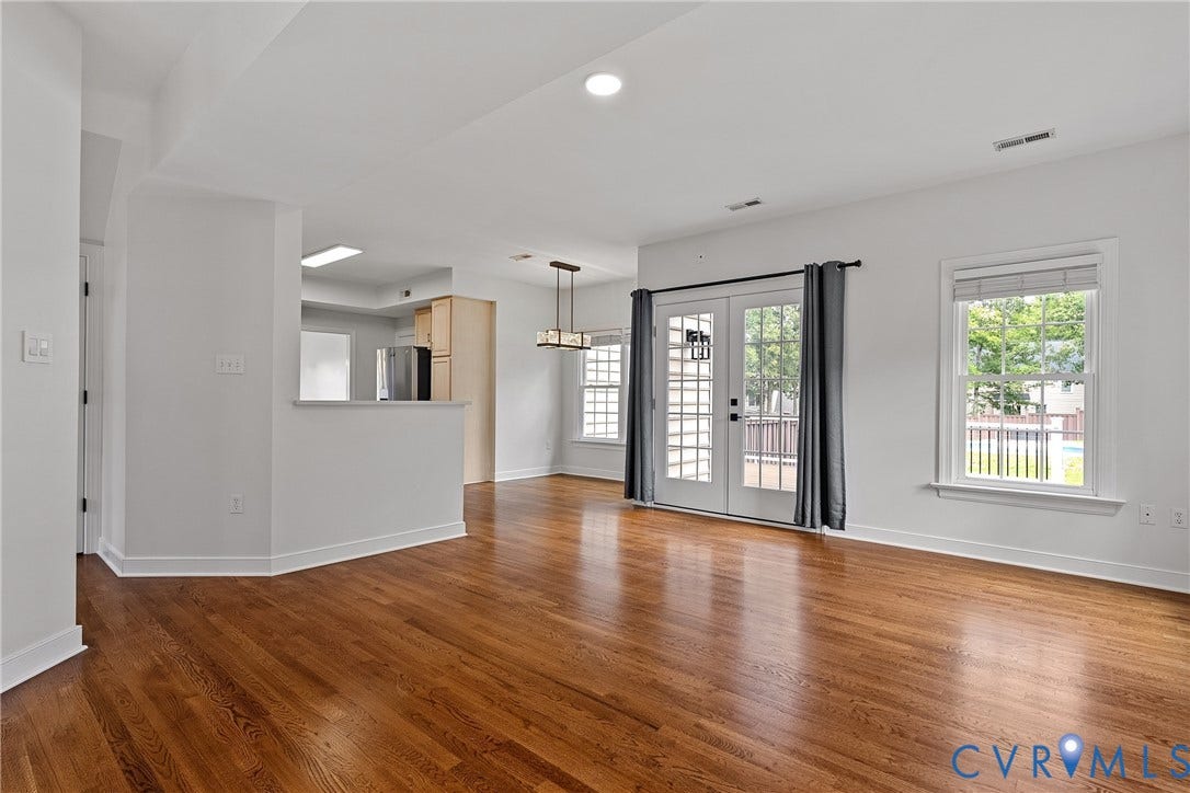11100 Glen Hollow Court, Henrico, VA 23233 Hardwood flooring, recessed lighting, white walls, double French doors, and a decorative light fixture