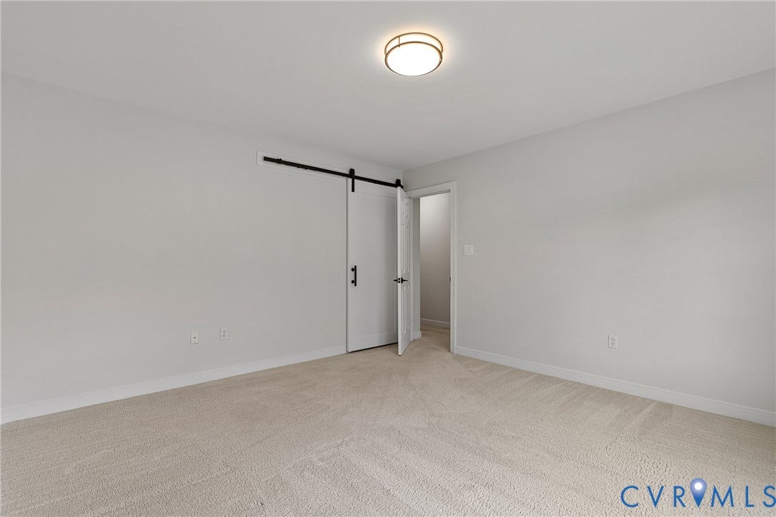 11100 Glen Hollow Court, Henrico, VA 23233 Carpeted flooring throughout, recessed lighting fixture, white walls, and a sliding barn door with black hardware