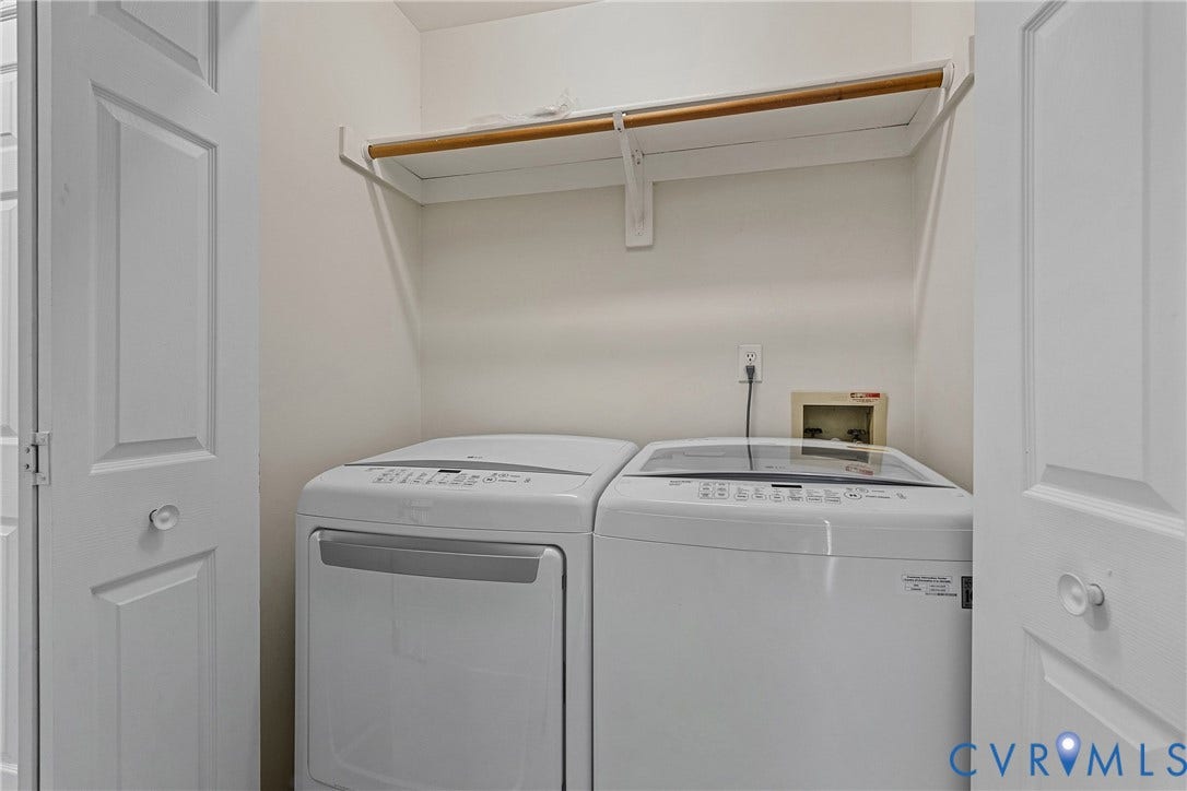11100 Glen Hollow Court, Henrico, VA 23233 Built-in shelving unit with an integrated clothing rod, featuring panel doors