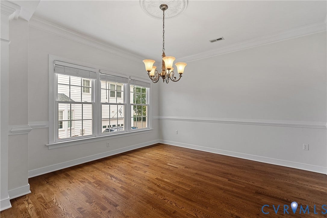 11100 Glen Hollow Court, Henrico, VA 23233 Hardwood flooring, crown molding, chair rail, decorative ceiling medallion, and a multi-light chandelier