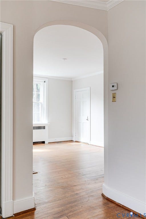 4010 Patterson Avenue, #1stfl, Richmond, VA 23221 Arched doorway with crown molding, hardwood flooring, and white trim