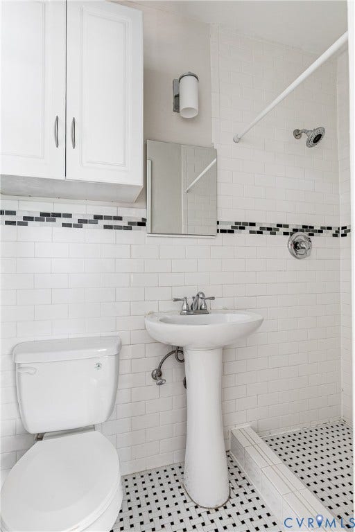 4010 Patterson Avenue, #1stfl, Richmond, VA 23221 White subway tile walls with a black and white mosaic tile floor