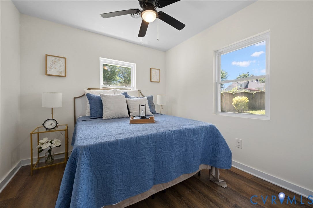 2911 Poplar Street, Hopewell, VA 23860 Wood-finish flooring, white walls, and a ceiling fan with integrated lighting