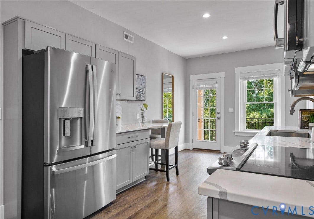 2902 Idlewood, #5, Richmond, VA 23221 Kitchen featuring stainless steel appliances, wood-finish flooring, recessed lighting, white countertops, and a full-light door