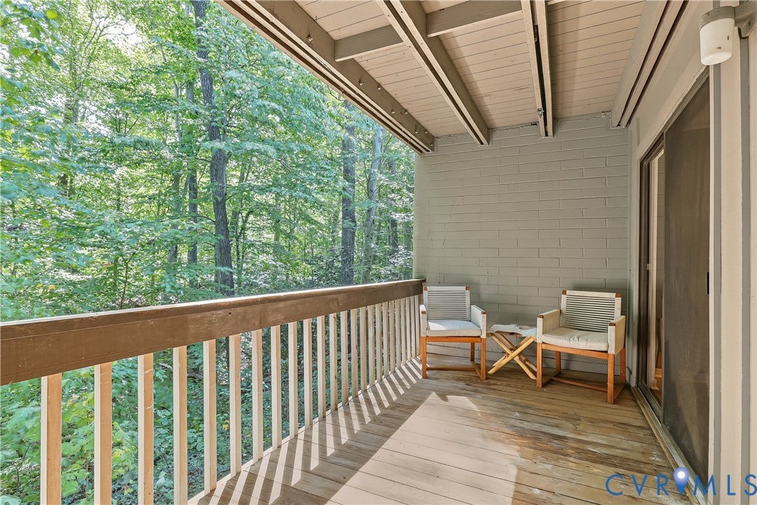 10272 Iron Mill Road, North Chesterfield, VA 23235 Wood-finish deck with a wood railing and a brick-finish wall
