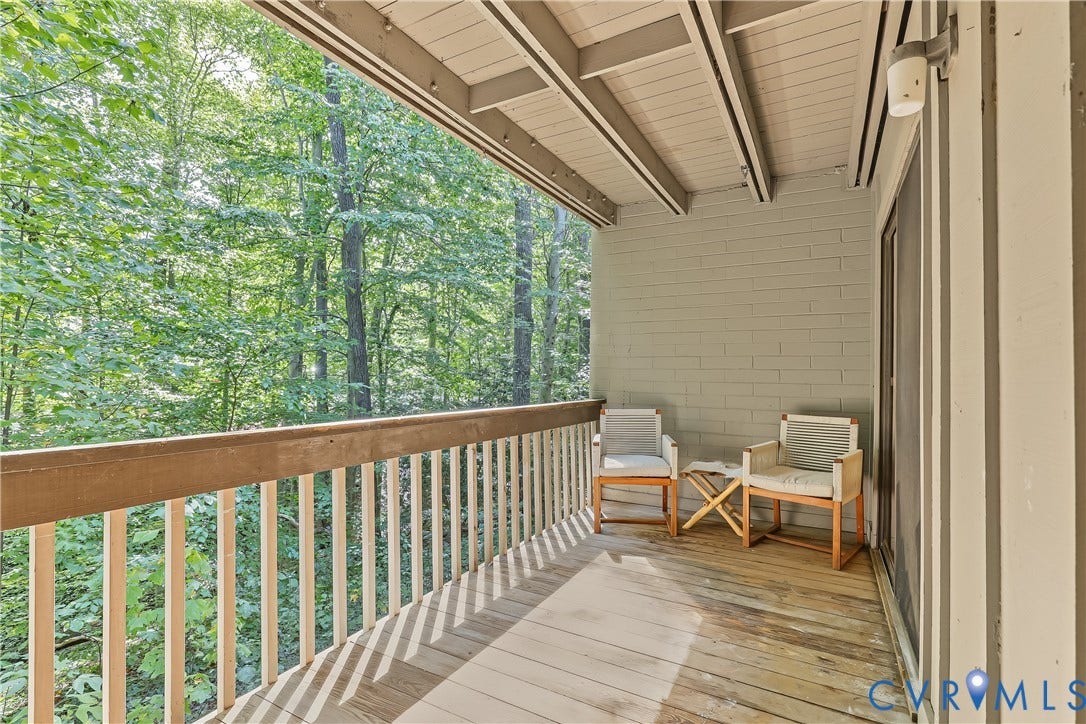 10272 Iron Mill Road, North Chesterfield, VA 23235 Private balcony featuring wood-finish decking, painted brick wall, and a wood railing
