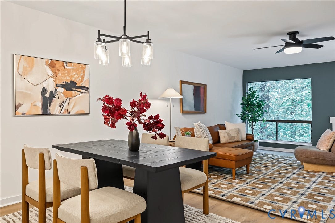 10272 Iron Mill Road, North Chesterfield, VA 23235 Open-concept living space featuring wood-finish flooring, a modern chandelier, and a large window