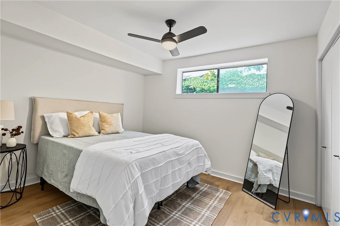 10272 Iron Mill Road, North Chesterfield, VA 23235 Wood-finish flooring, white walls, and a modern ceiling fan with integrated lighting