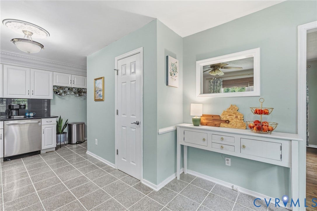 6723 Cherry Road, Woodhaven Shores, Quinton, VA 23141 Kitchen area featuring gray tile flooring, white cabinetry, stainless steel appliances, and dark countertops