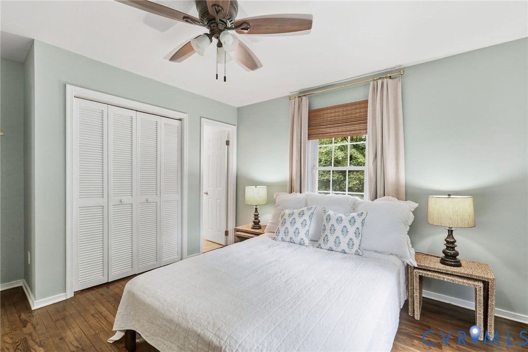 6723 Cherry Road, Woodhaven Shores, Quinton, VA 23141 Wood-finish flooring, louvered closet doors, window with woven shade, and ceiling fan