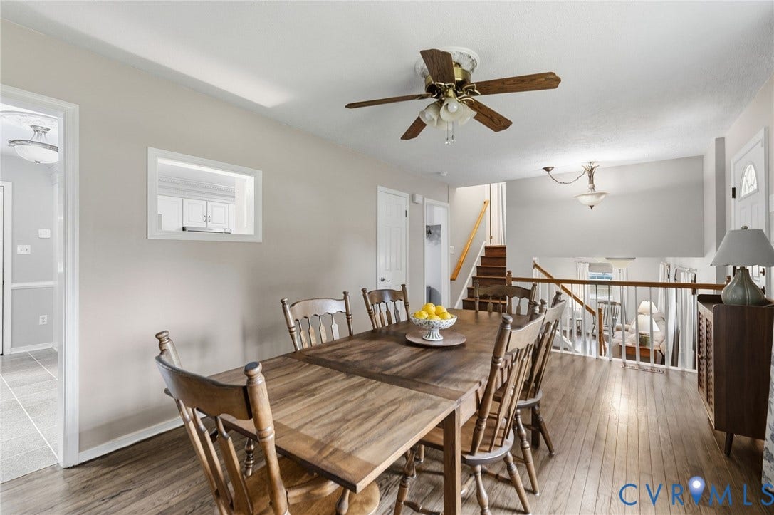 6723 Cherry Road, Woodhaven Shores, Quinton, VA 23141 Wood-finish flooring throughout, ceiling fan with light fixture, and pass-through window with trim
