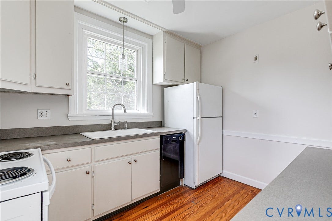 4010 Patterson Avenue, #2ndfl, Richmond, VA 23221 White cabinetry, wood-finish flooring, white appliances, and a window above the sink