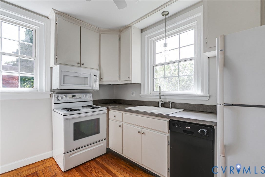 4010 Patterson Avenue, #2ndfl, Richmond, VA 23221 Kitchen featuring shaker-style cabinetry, wood-finish flooring, a white electric range, an over-the-range microwave, and a black dishwasher