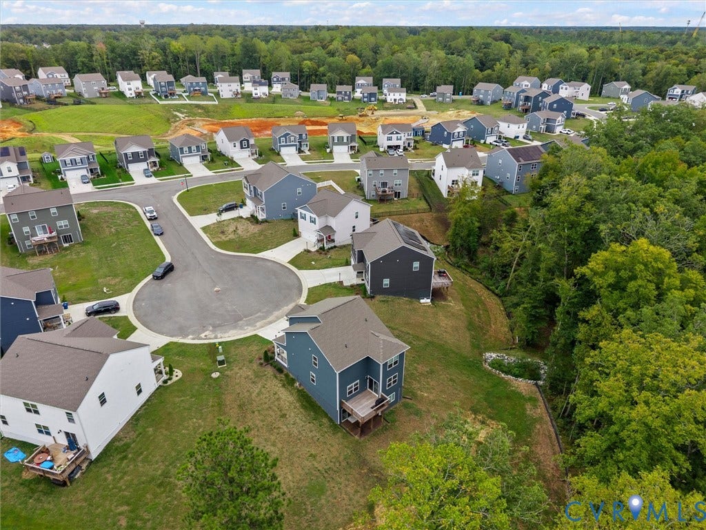 6901 Switch Cane Court, The Arbors, New Kent, VA 23141 Neighborhood featuring residential properties with varying exterior finishes, cul-de-sac street design, and natural wooded areas