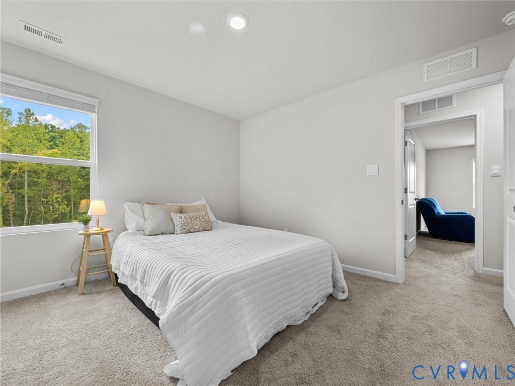 6901 Switch Cane Court, The Arbors, New Kent, VA 23141 Neutral wall paint, recessed lighting, double-hung window, light-toned carpeting, and a white interior door