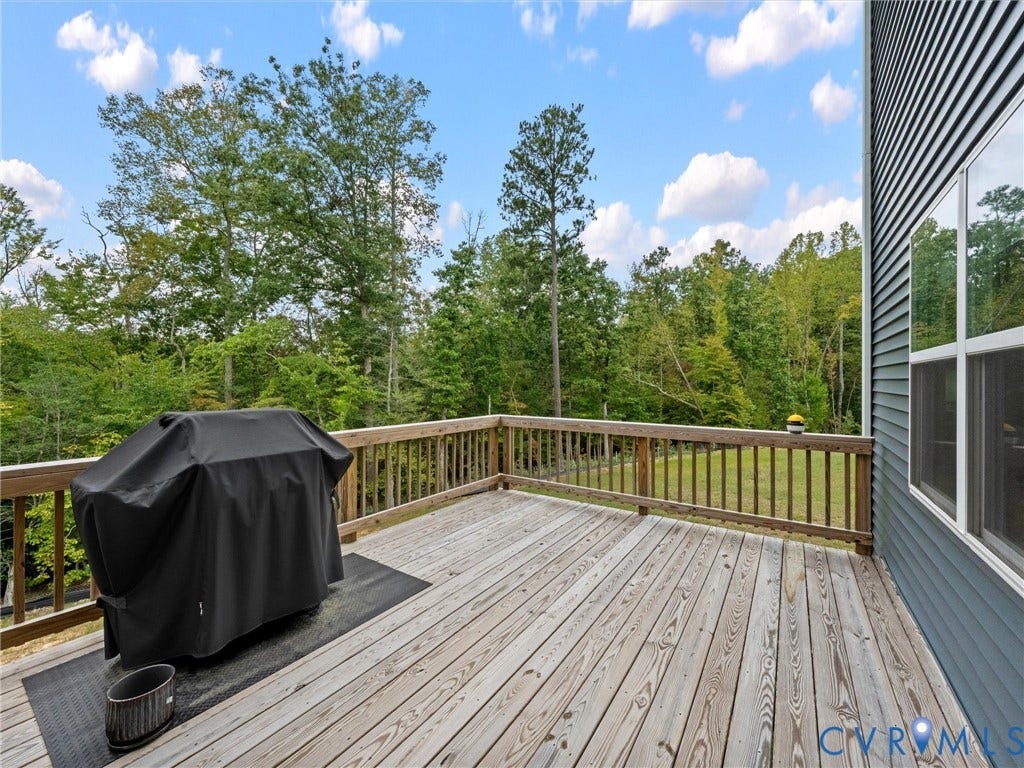 6901 Switch Cane Court, The Arbors, New Kent, VA 23141 Expansive wood deck with a wood railing and panel siding