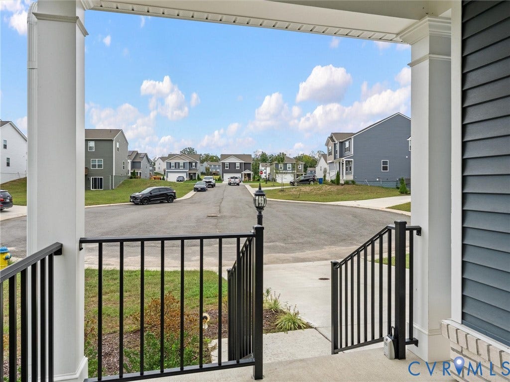 6901 Switch Cane Court, The Arbors, New Kent, VA 23141 Front porch with white columns, black metal railings, and grey siding