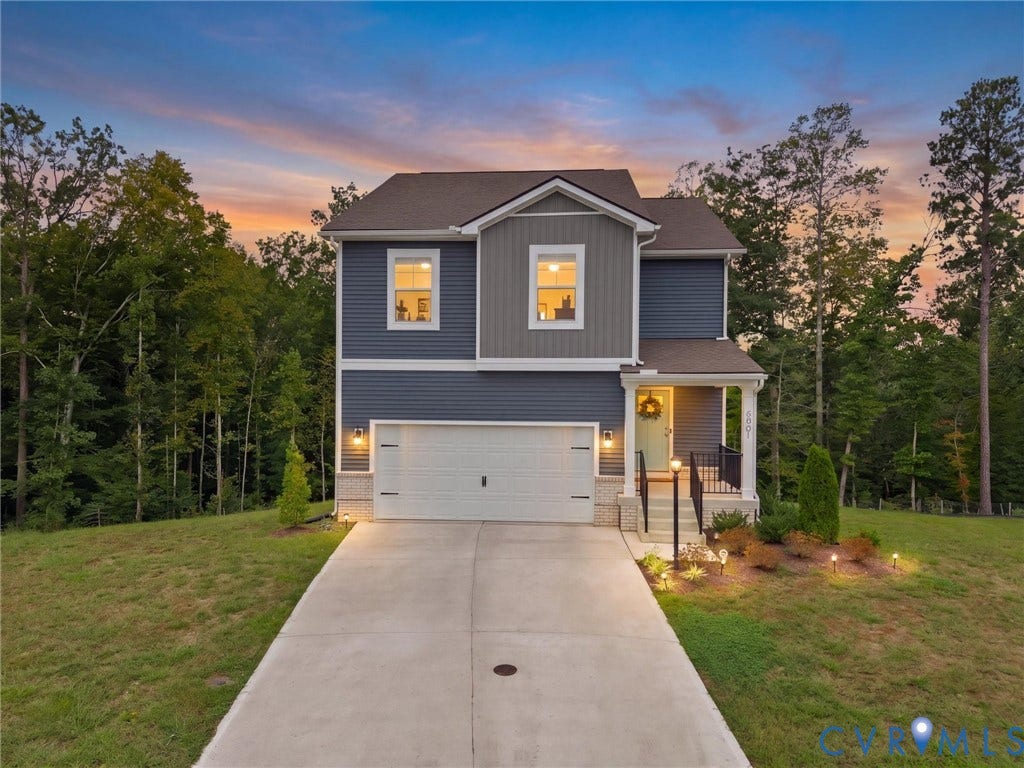 6901 Switch Cane Court, The Arbors, New Kent, VA 23141 Two-story exterior with a covered front porch and column accents, featuring a two-tone facade with horizontal siding and vertical paneling