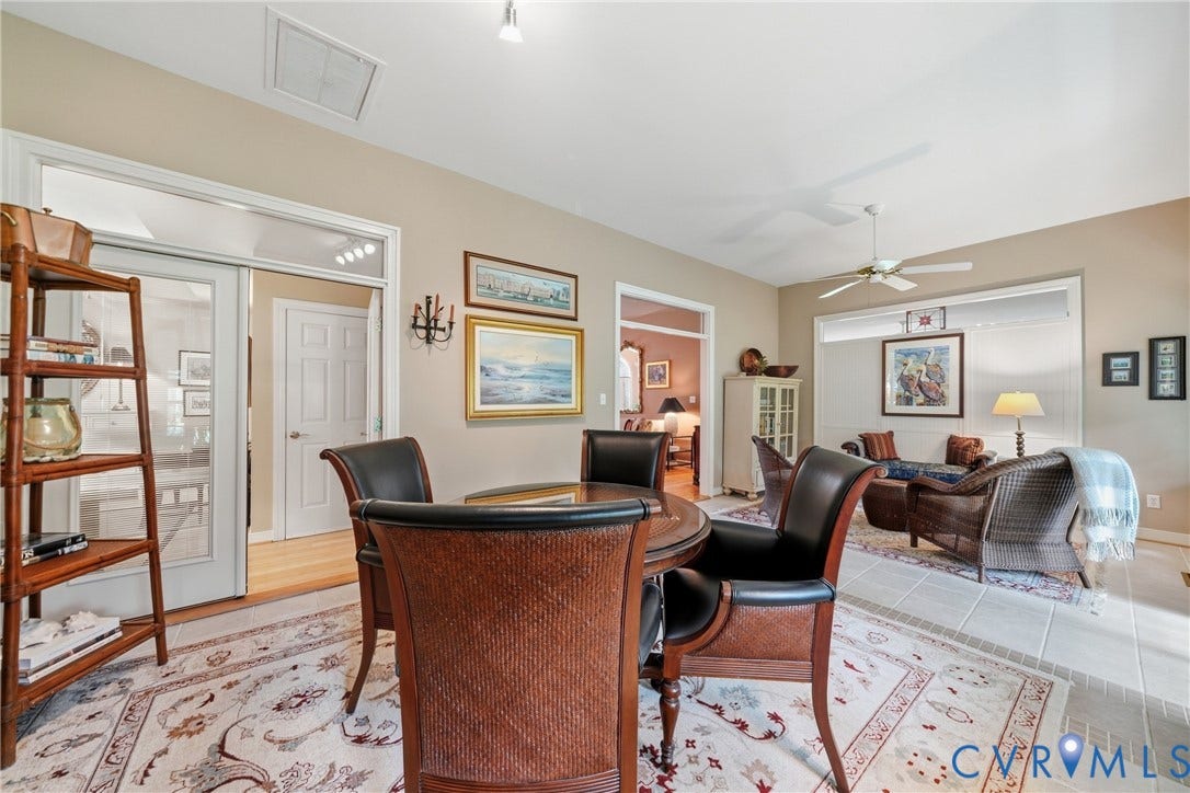 Tiled flooring, high ceilings, ceiling fan, and transom windows