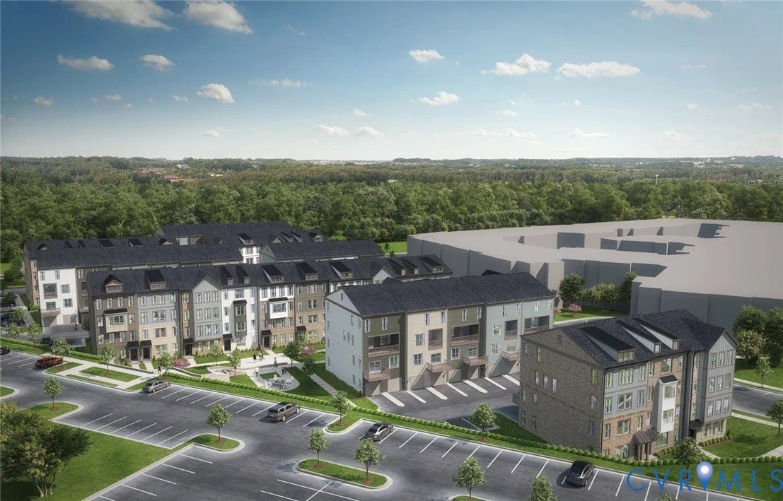 Contemporary townhome community featuring multi-level residences with varied faade materials