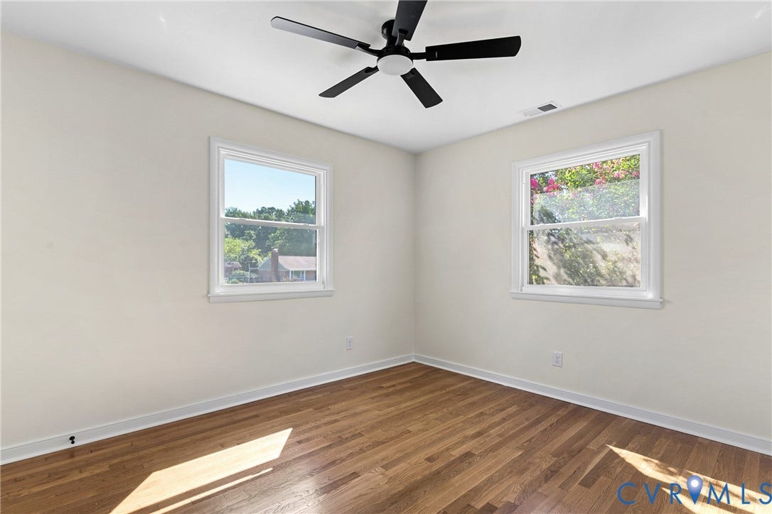 7402 Edgewood Avenue, Richmond, VA 23227 Wood-finish flooring with white wall finishes, dual pane windows, and a ceiling fan