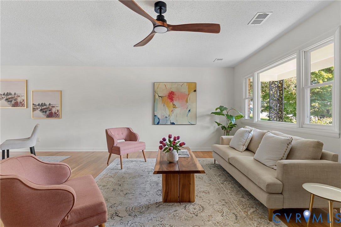 7402 Edgewood Avenue, Richmond, VA 23227 Wood-finish flooring with white walls, multiple large windows, and a modern ceiling fan