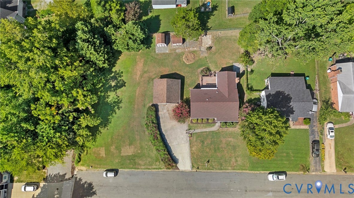 7402 Edgewood Avenue, Richmond, VA 23227 Expansive property featuring a paved driveway, detached garage, and mature trees