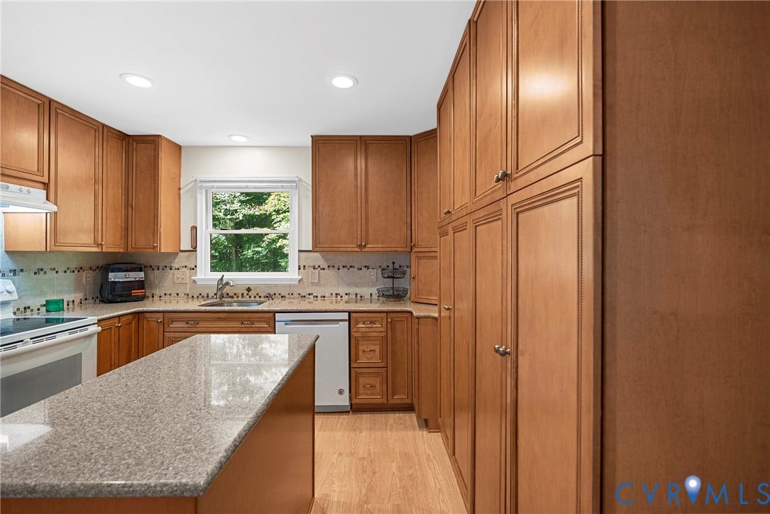 12082 Victoria Hills Road, Rockville, VA 23146 Kitchen featuring wood cabinetry, floor-to-ceiling pantry storage, stone-surface countertops, recessed lighting, and tile backsplash