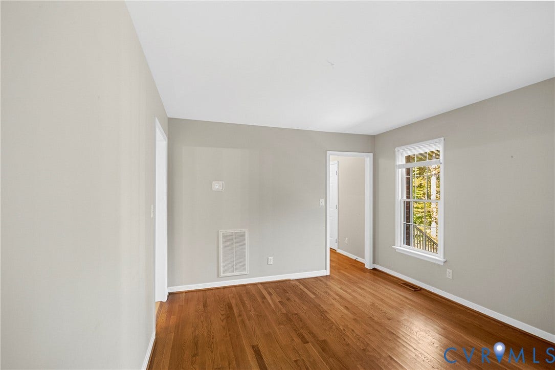 12082 Victoria Hills Road, Rockville, VA 23146 Neutral wall finishes, wood-finish flooring, and a multi-pane window