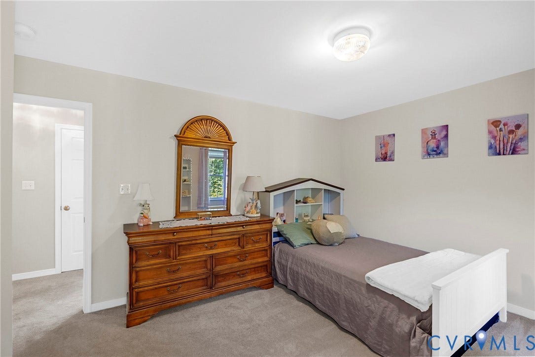 12082 Victoria Hills Road, Rockville, VA 23146 Neutral-toned interior space featuring carpeting, smooth wall finish, and a ceiling-mounted light fixture